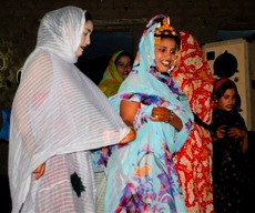 offering gifts to the dancers