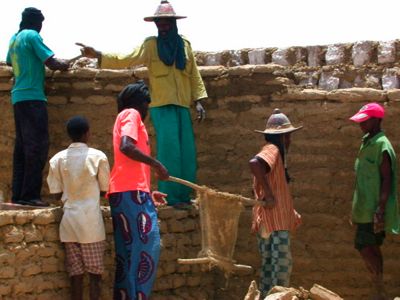 Masons building a house