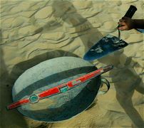cement trowel, mixing bowl and level